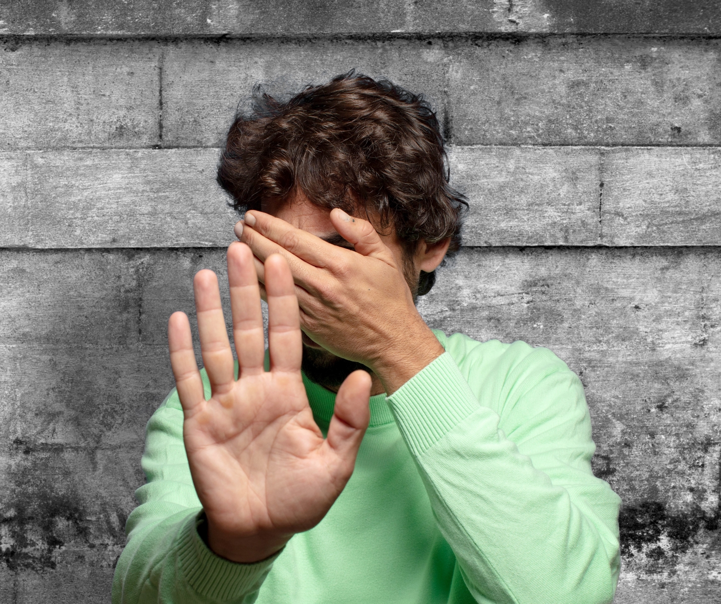 Hand with NO written on palm